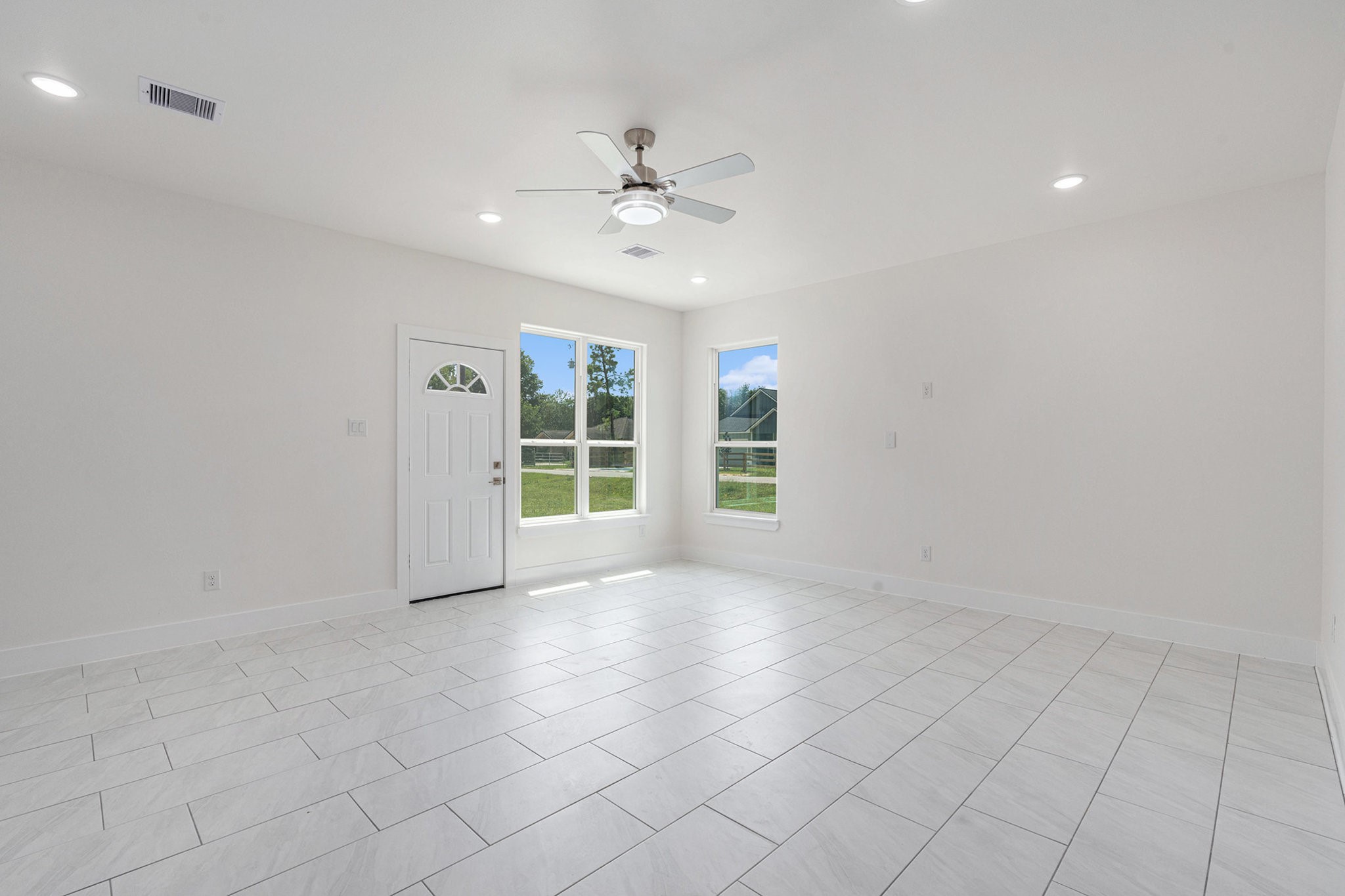 702 Azalea Street Waller, TX 77484 - Photo 6 of 45 a view of an empty room with a window
