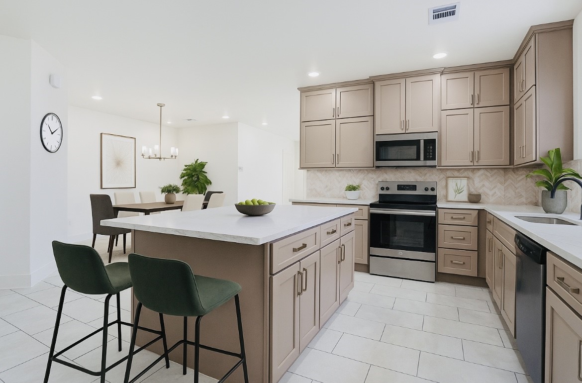 702 Azalea Street Waller, TX 77484 - Photo 10 of 45 a kitchen with stainless steel appliances a sink stove and cabinets