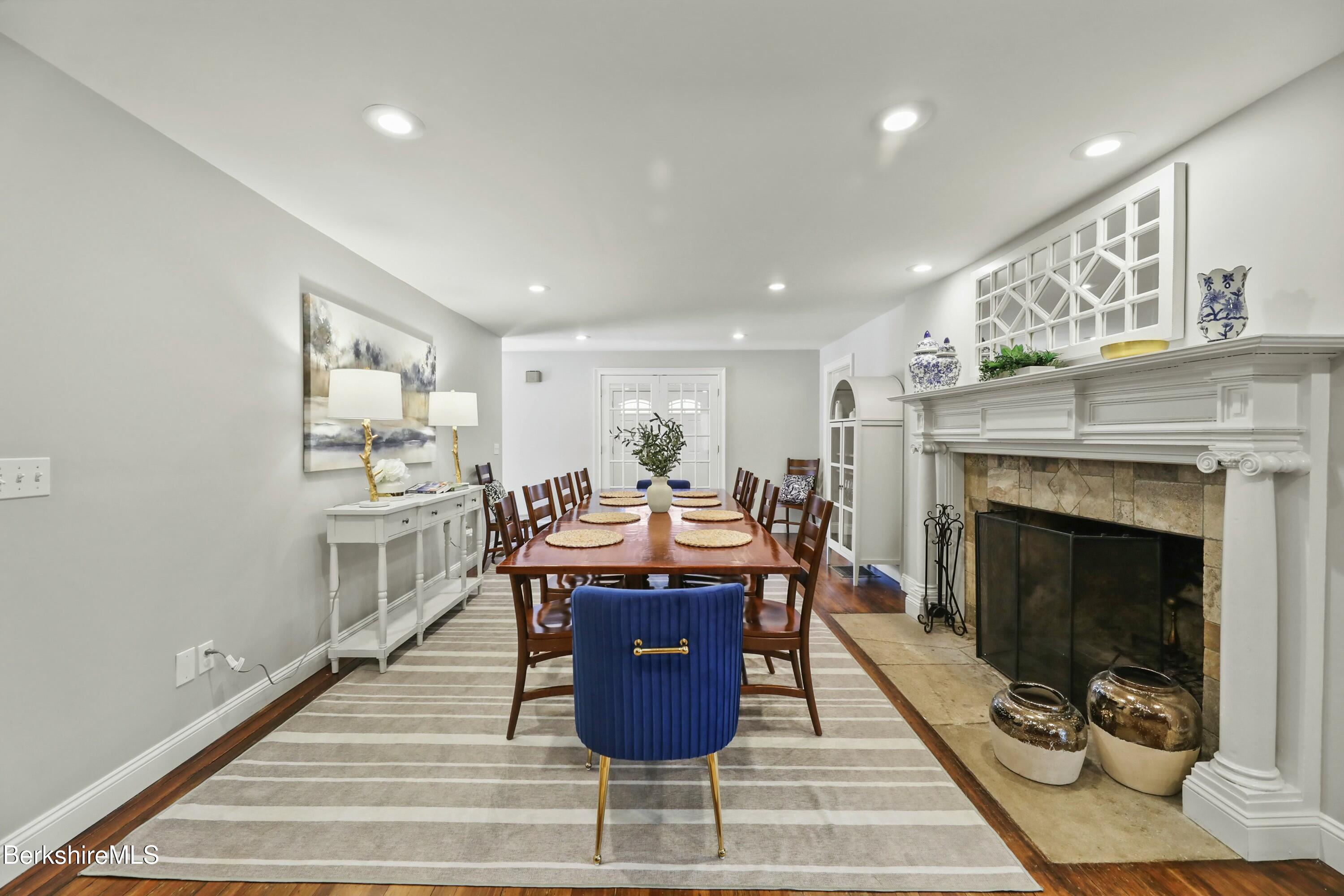1 Devon Road Stockbridge, MA 01262 - Photo 11 of 45 a living room with furniture a fireplace and kitchen view