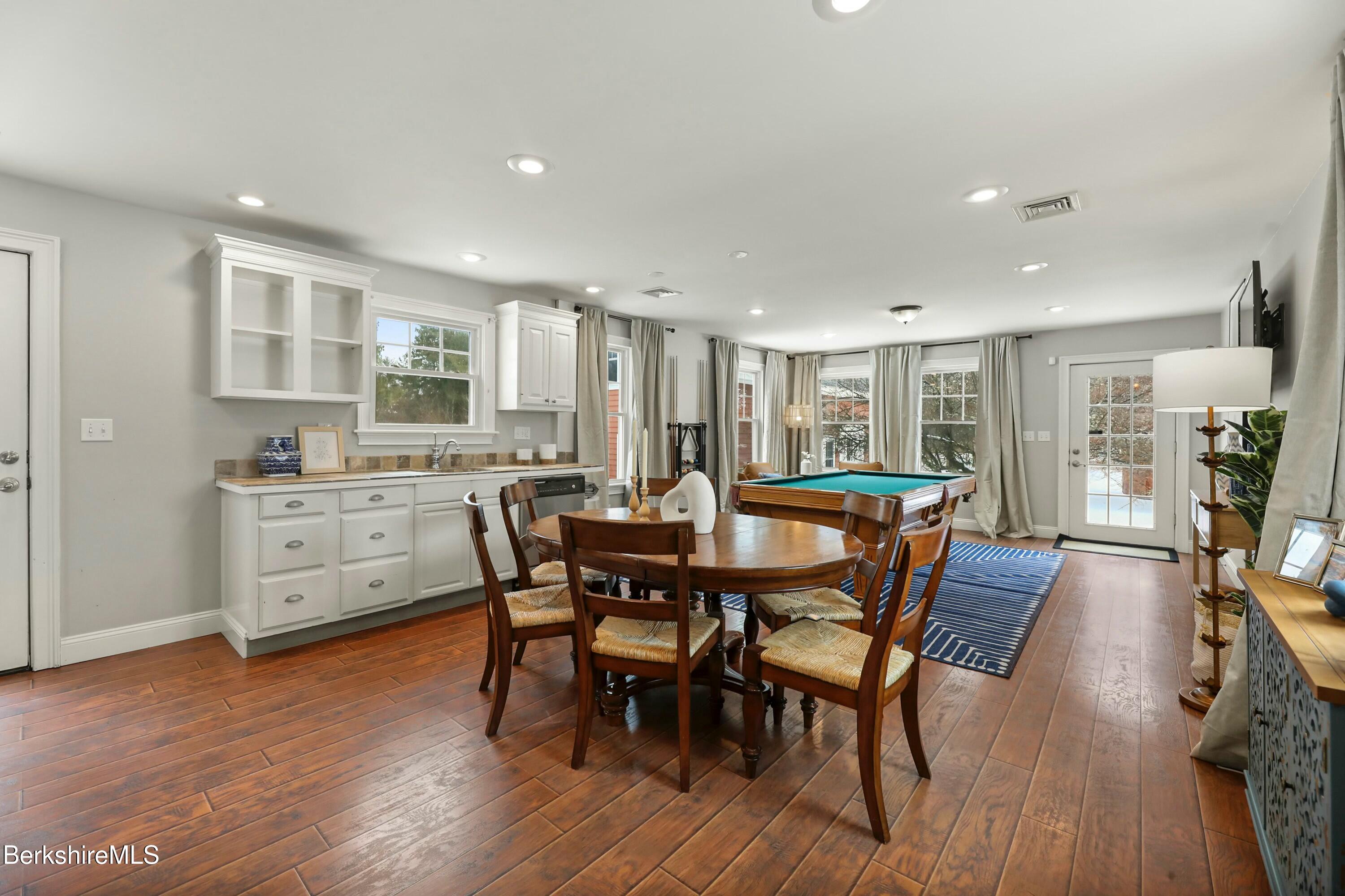 1 Devon Road Stockbridge, MA 01262 - Photo 17 of 45 a view of a dining area with furniture and wooden floor