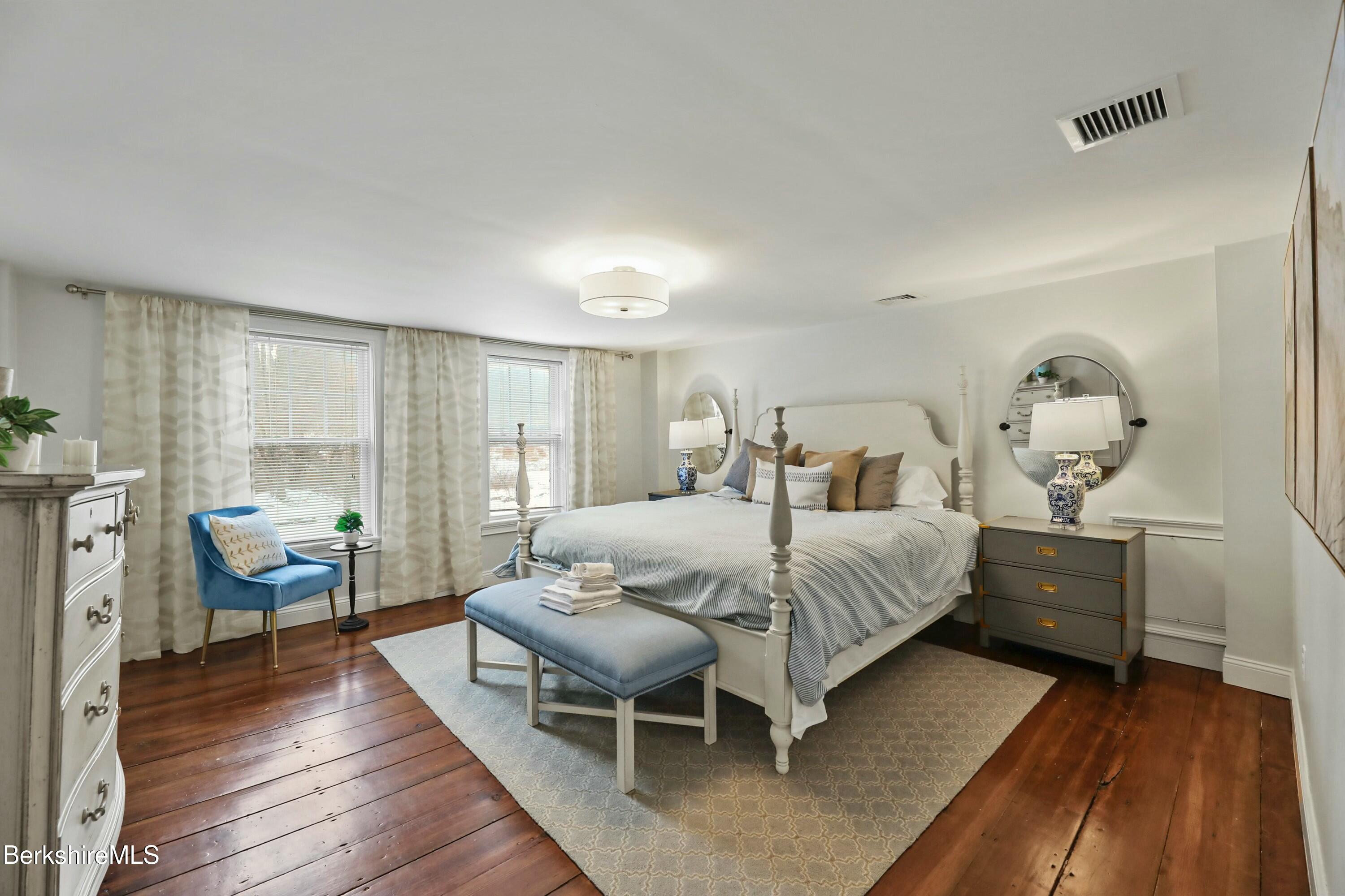 1 Devon Road Stockbridge, MA 01262 - Photo 22 of 45 a bedroom with a bed and wooden floor