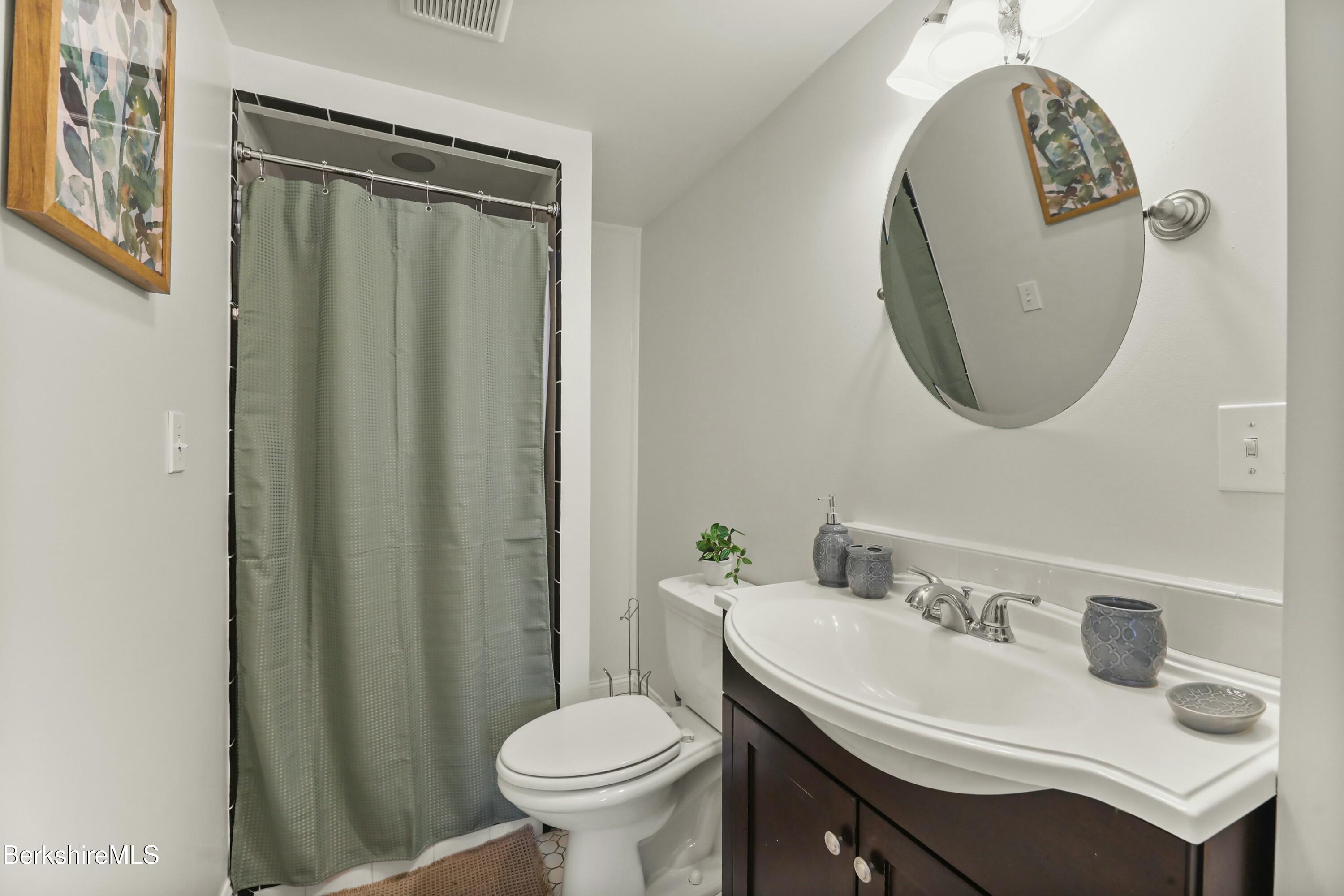 1 Devon Road Stockbridge, MA 01262 - Photo 31 of 45 a bathroom with a sink toilet and a mirror