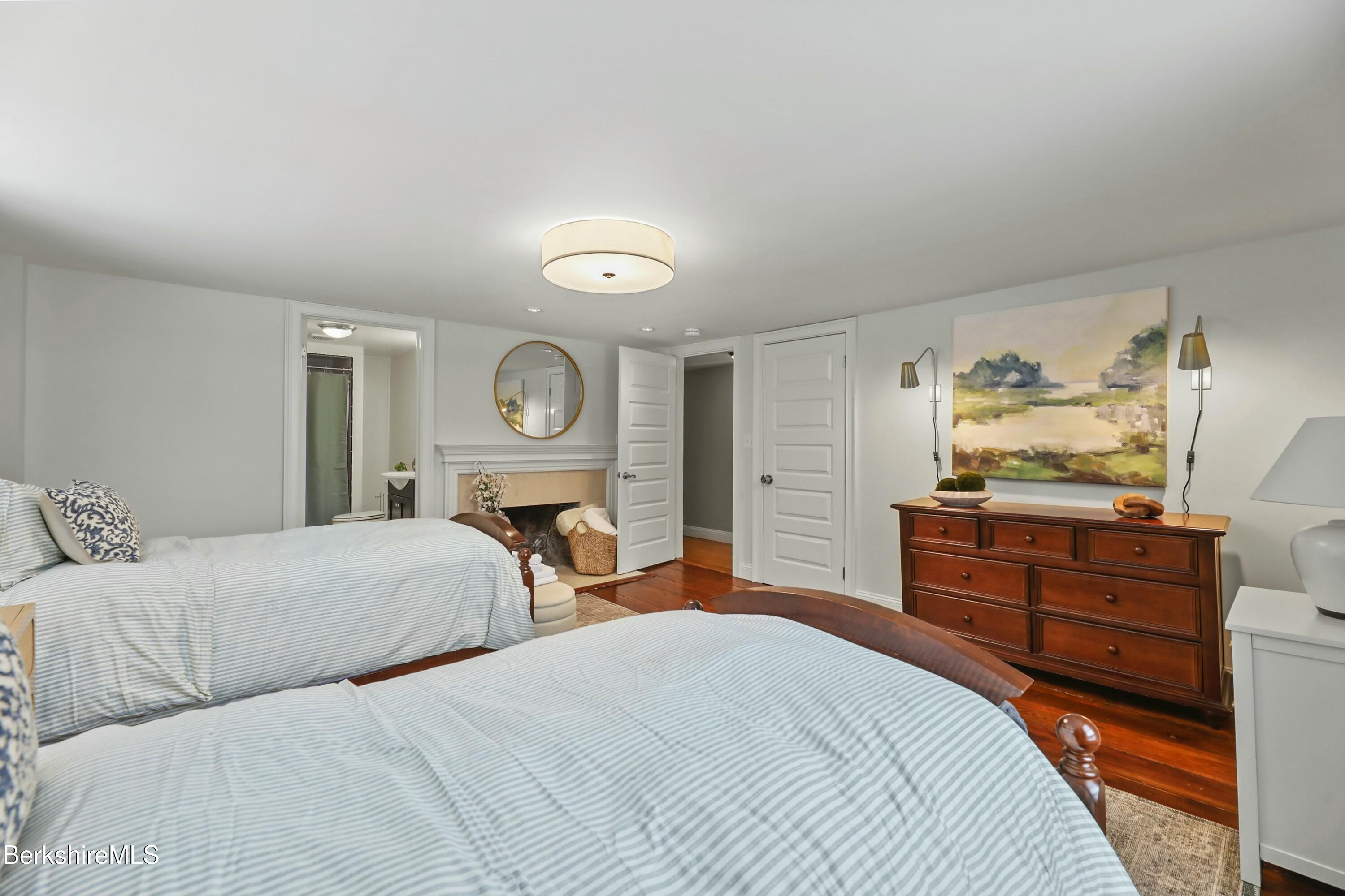 1 Devon Road Stockbridge, MA 01262 - Photo 34 of 45 a bedroom with a bed and closet with mirror