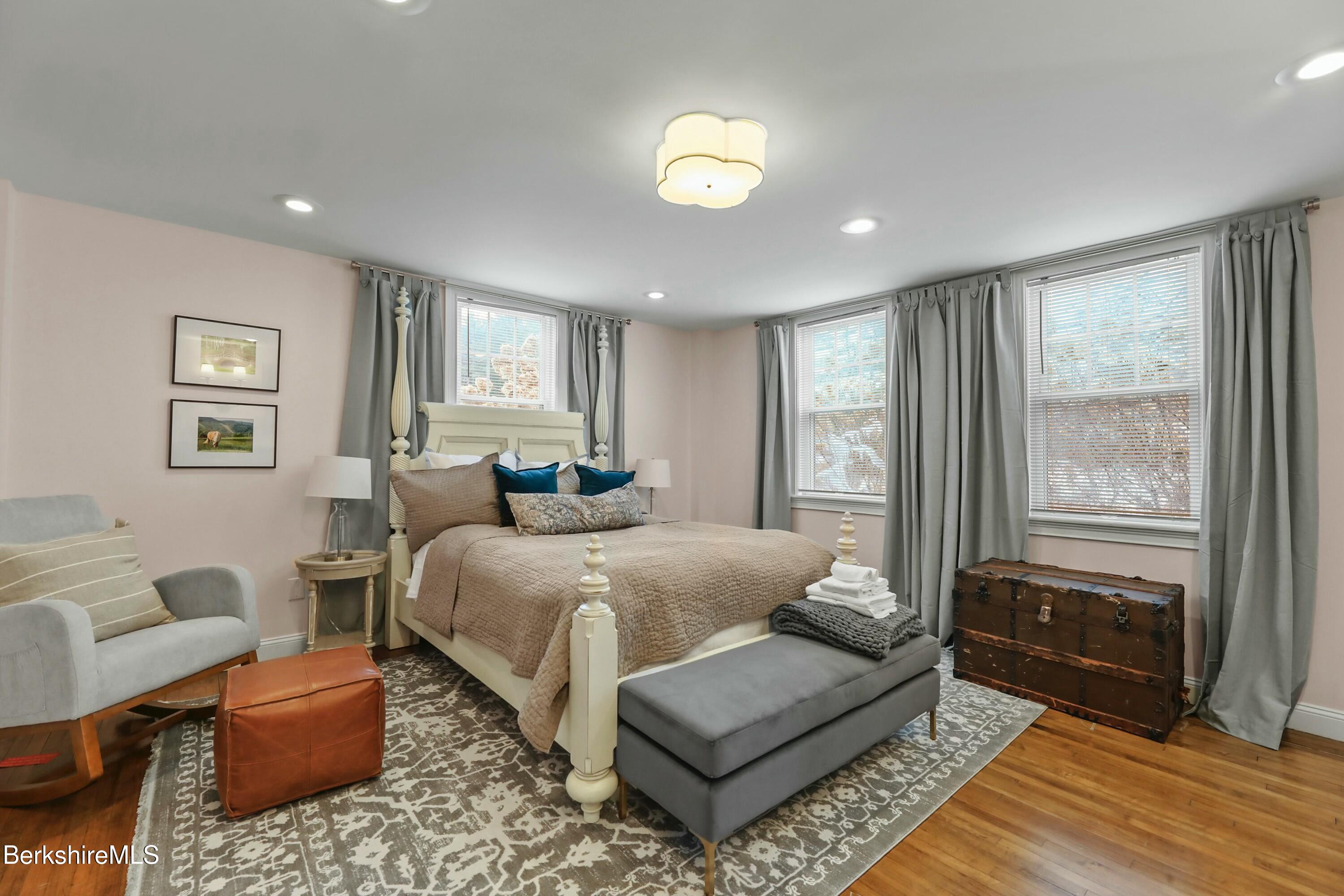 1 Devon Road Stockbridge, MA 01262 - Photo 40 of 45 a spacious bedroom with a bed a couch and a window