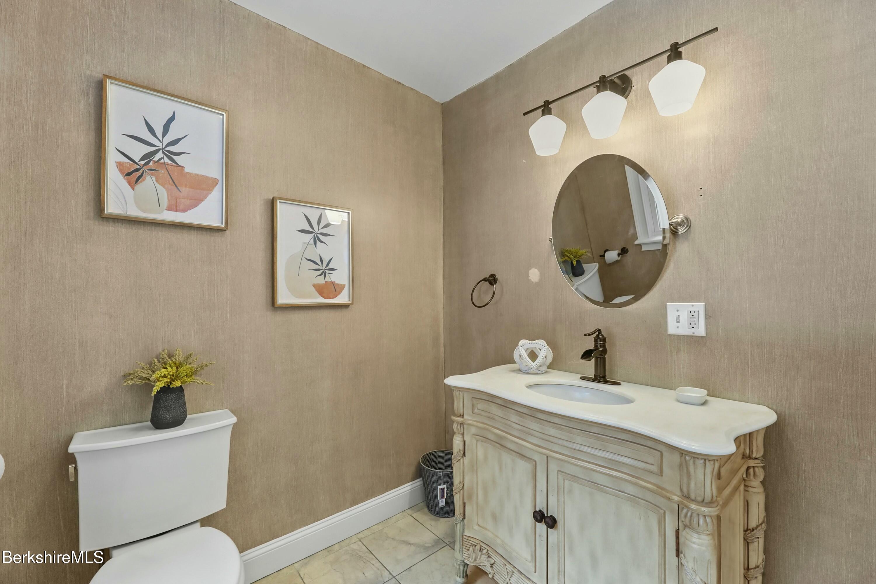 1 Devon Road Stockbridge, MA 01262 - Photo 42 of 45 a bathroom with a toilet a sink and mirror