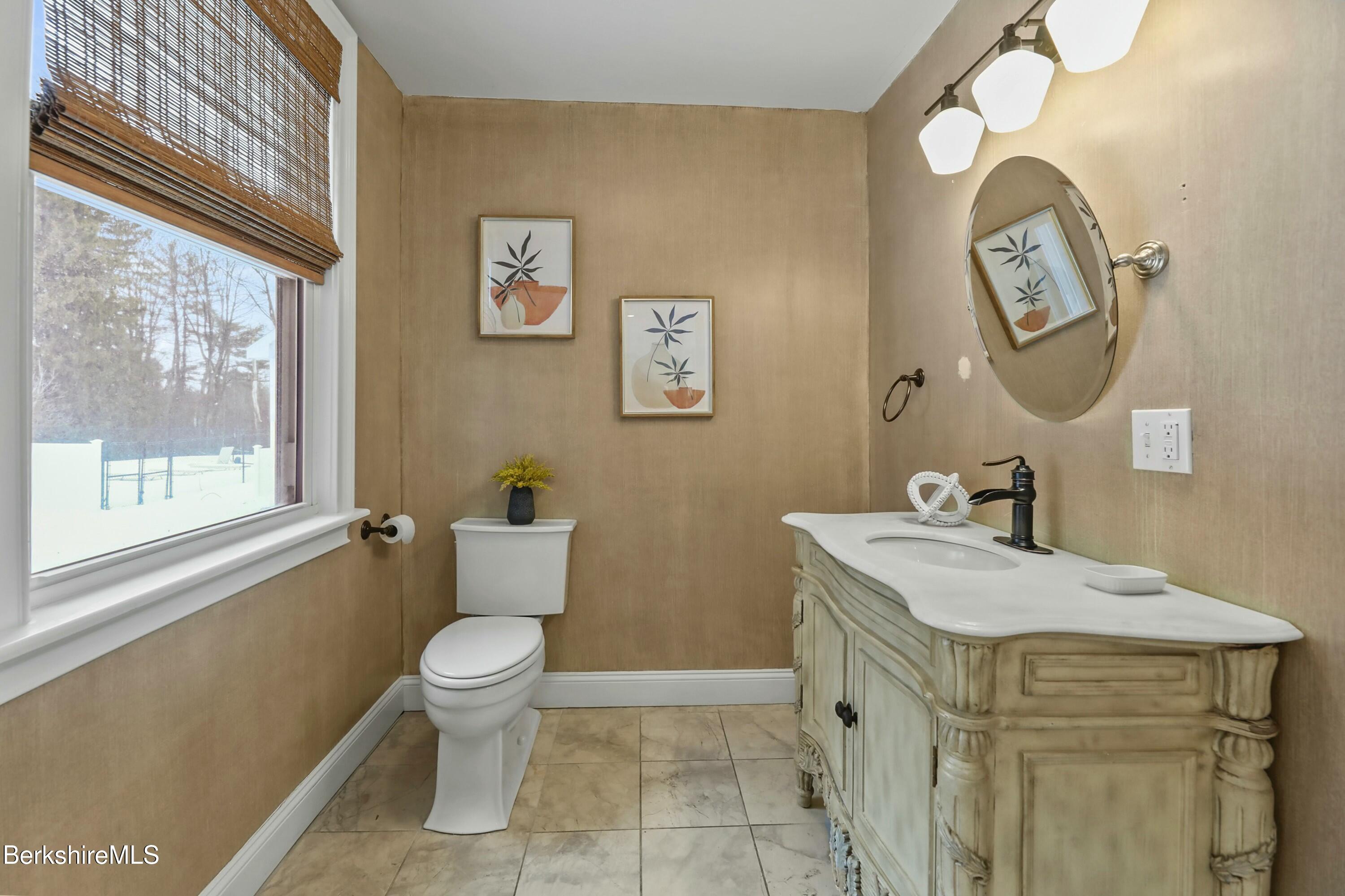 1 Devon Road Stockbridge, MA 01262 - Photo 43 of 45 a bathroom with a sink a toilet and a mirror