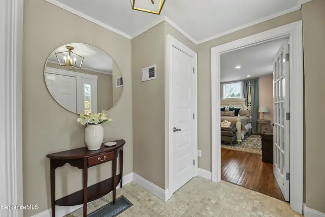 a view of hall way with mirror