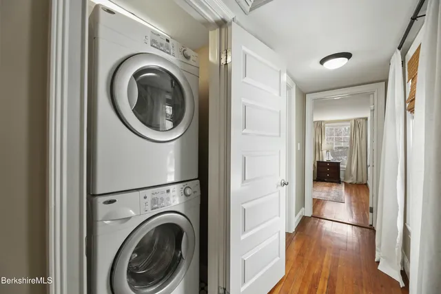 a view of a hallway with washer and dryer