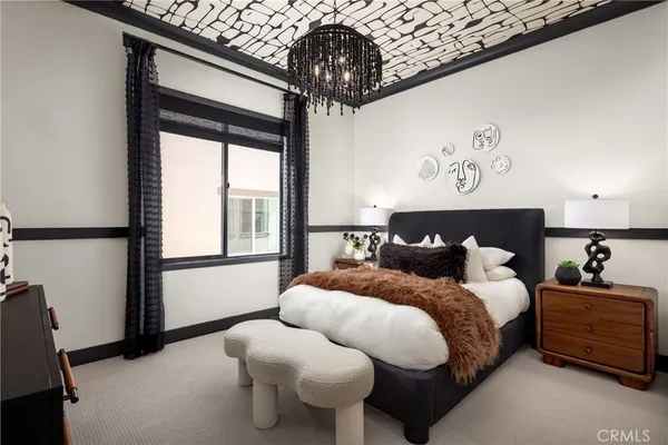 a bedroom with bed and window