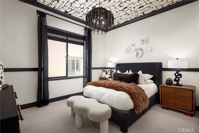 a bedroom with bed and window