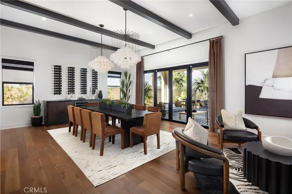 a living room with furniture a window and a table