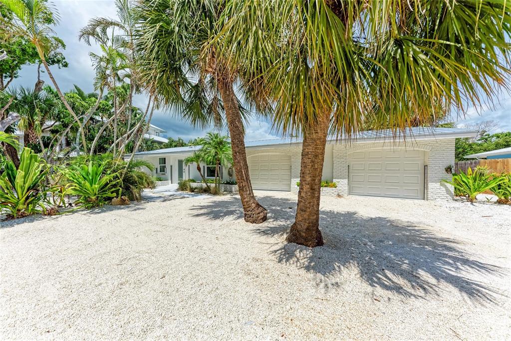 116 Hammock Road Anna Maria, FL 34216 - Photo 1 of 1 a view of a house with a yard and plant