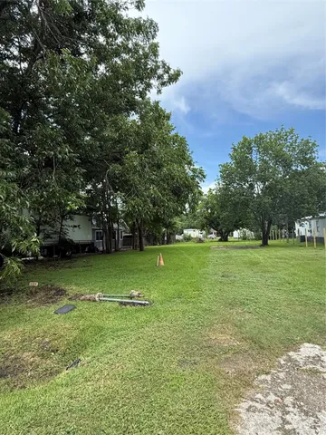 a view of field with trees in the background