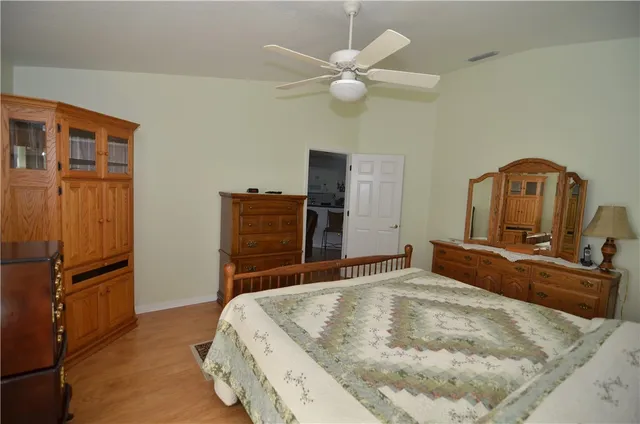 a bedroom with a bed and dresser