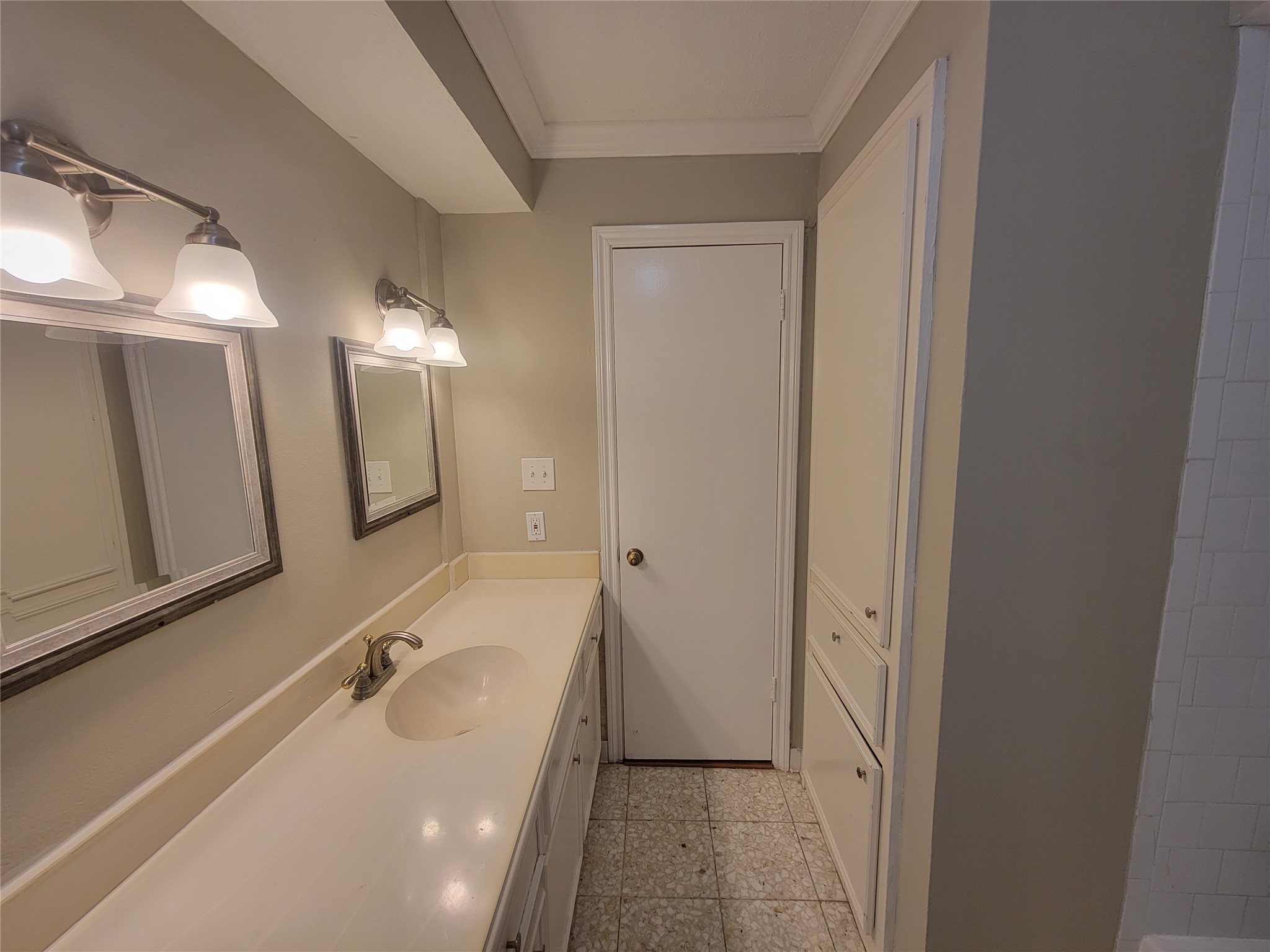 4015 Chapel Square Drive Spring, TX 77388 - Photo 21 of 27 This restroom features elegant lighting above the mirrors, enhancing its charm and functionality.