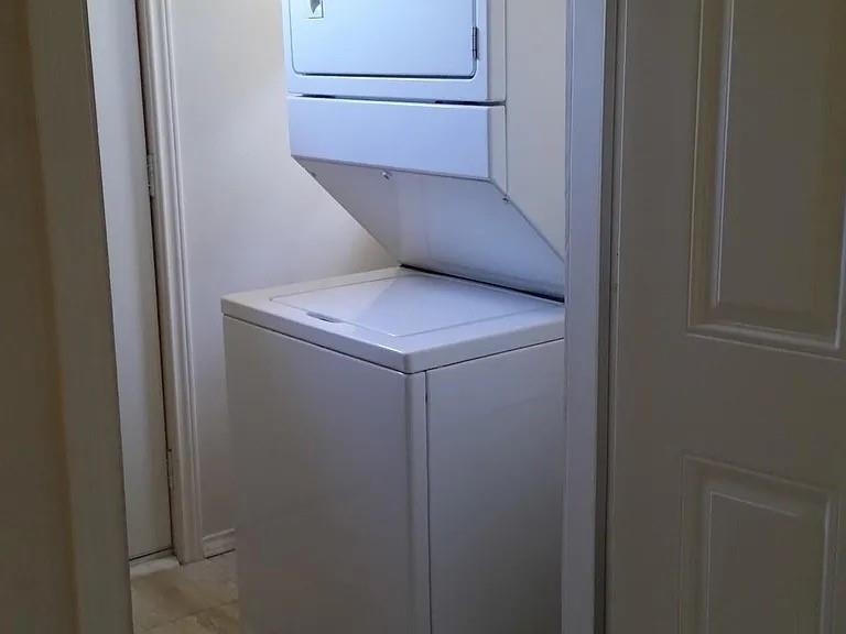 304 Fulton Street, Unit B Denton, TX 76201 - Photo 9 of 10 Laundry room with stacked washer / dryer