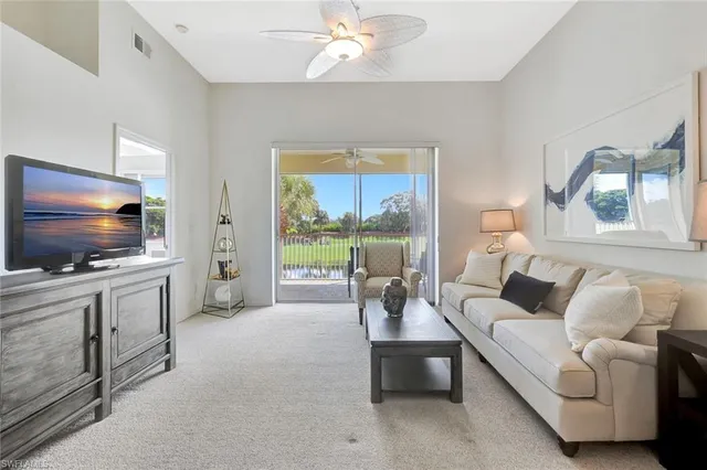 a view of a balcony with lake view and a table