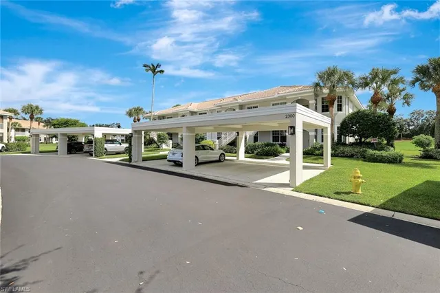 an aerial view of residential houses with outdoor space and river