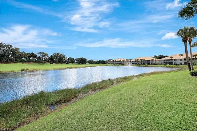 an aerial view of a house with a lake view