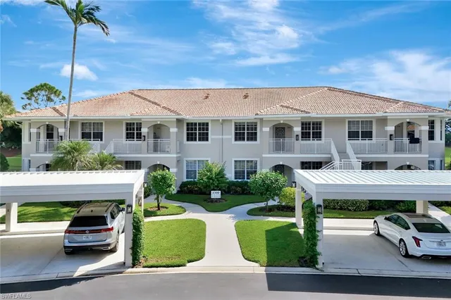 an aerial view of a house with big yard