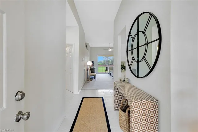 a kitchen with white cabinets sink and stainless steel appliances