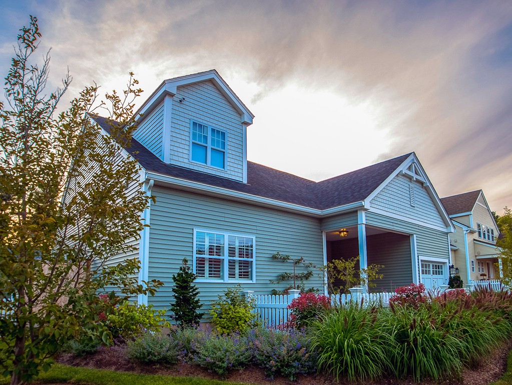 a front view of a house with garden