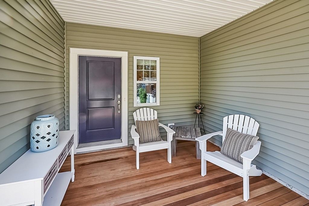 56 Lantern Way, Unit 56 Ashland, MA 01721 - Photo 2 of 8 a view of a two chairs in the balcony