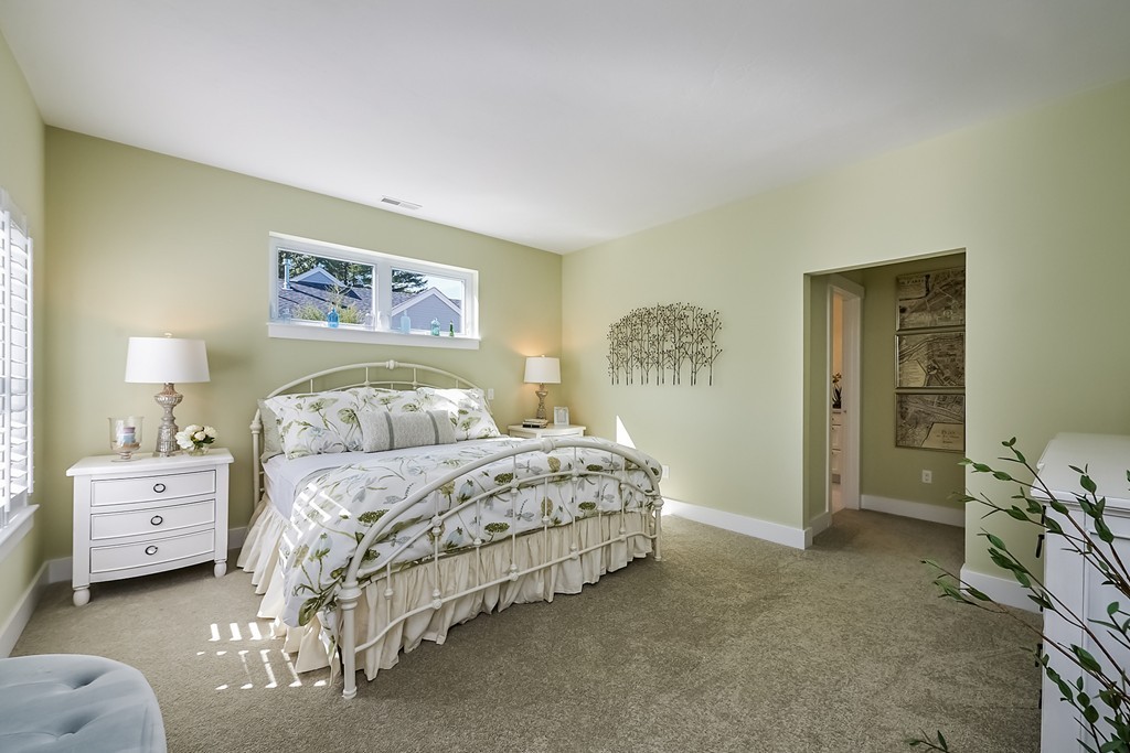 56 Lantern Way, Unit 56 Ashland, MA 01721 - Photo 6 of 8 a spacious bedroom with a bed and a cabinets