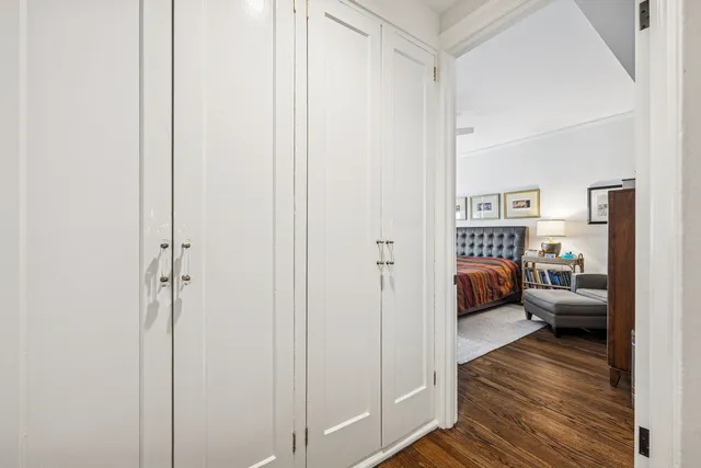 a bedroom with furniture and a closet