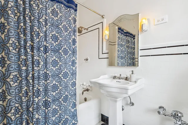 a bathroom with a sink and mirror