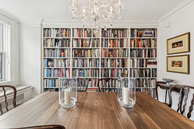 a view of a livingroom with furniture and staircase