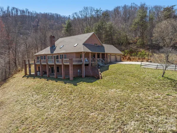 a aerial view of a house with a yard