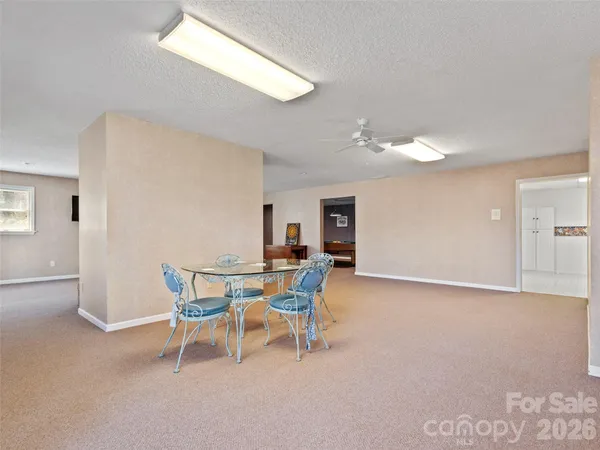 a view of a livingroom with furniture and a window