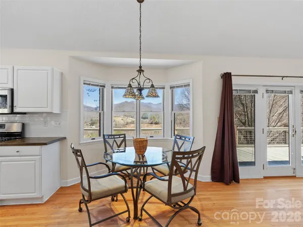 a view of a dining room with furniture window and outside view