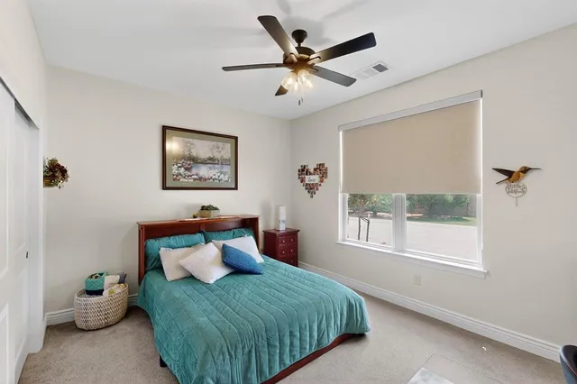 a bed room with a bed and a window