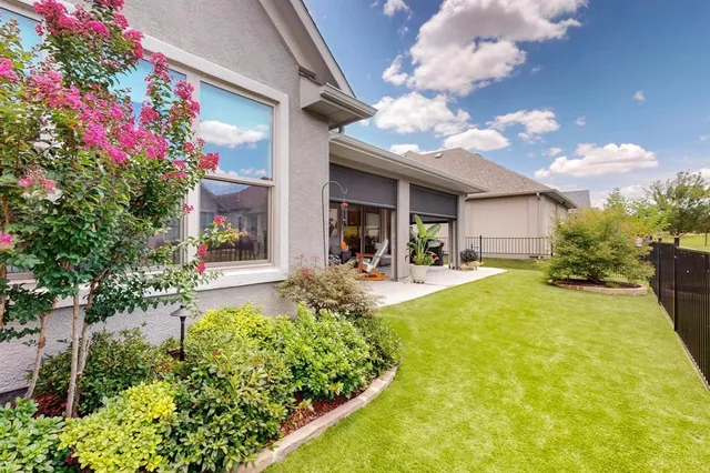 a view of an house with swimming pool garden and patio