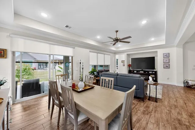 a view of a dining room with furniture window and wooden floor