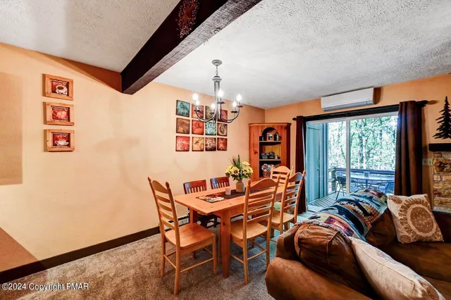 a view of living room with furniture and fireplace