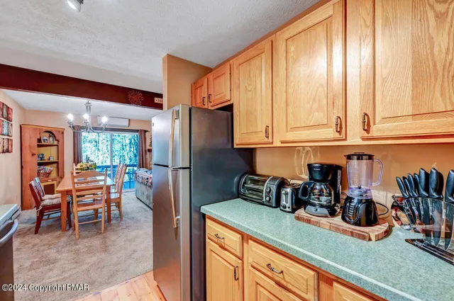 a bedroom with two beds and a chandelier