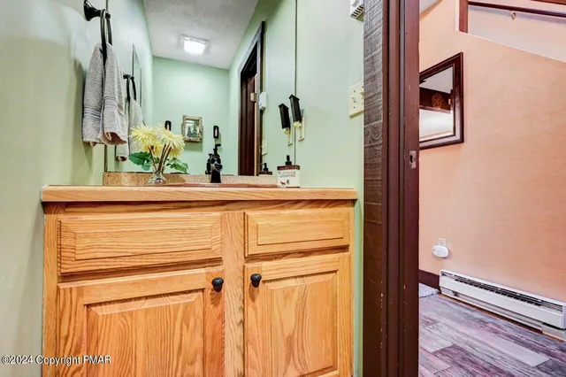 a bed room with a bed and a chandelier