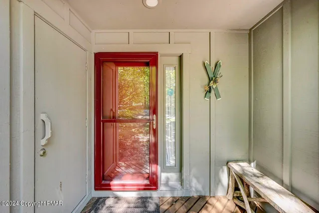 a living room with furniture ceiling fan and a rug