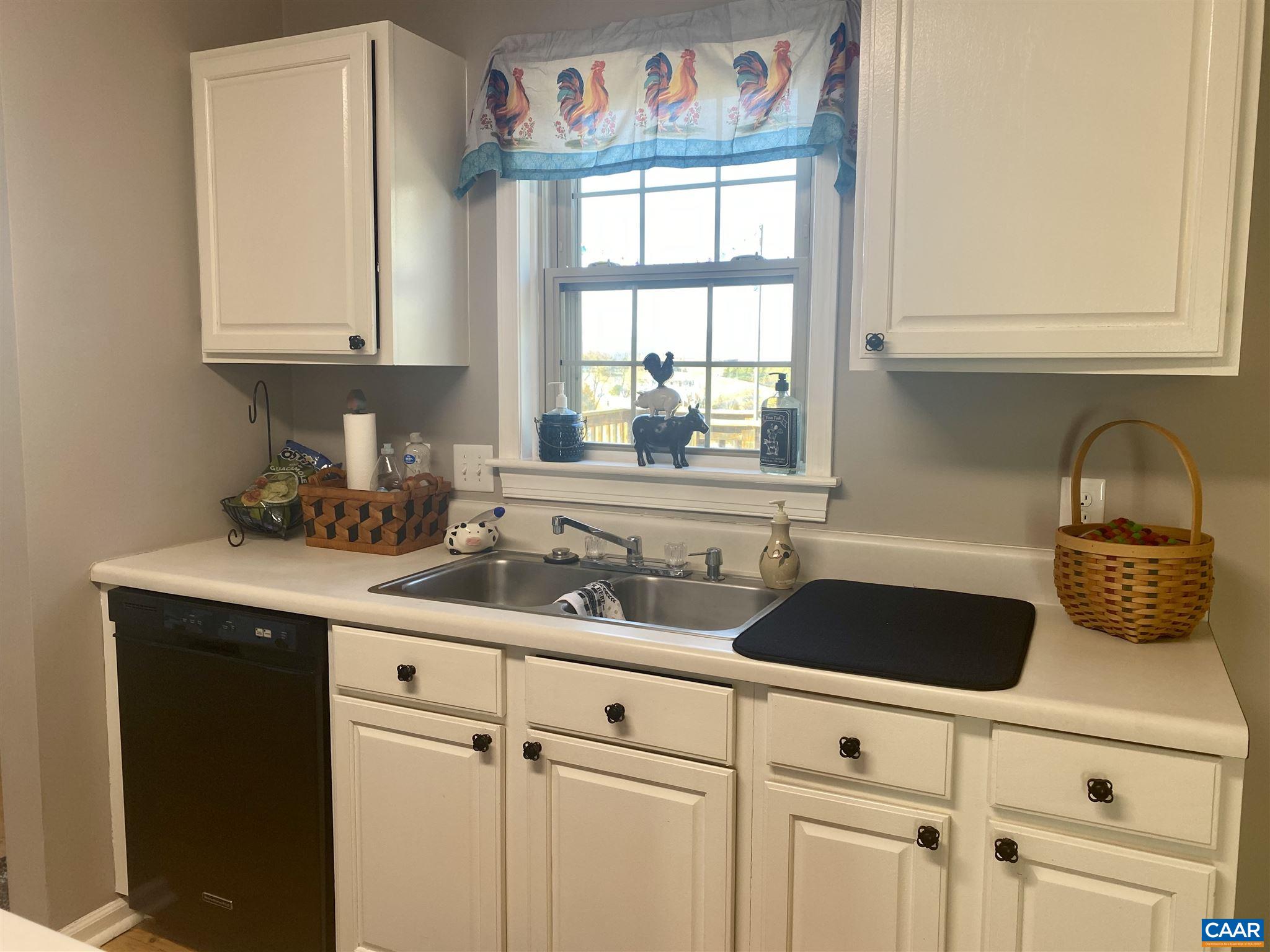 209 Varner Road Churchville, VA 24421 - Photo 22 of 54 a kitchen with white cabinets and a sink