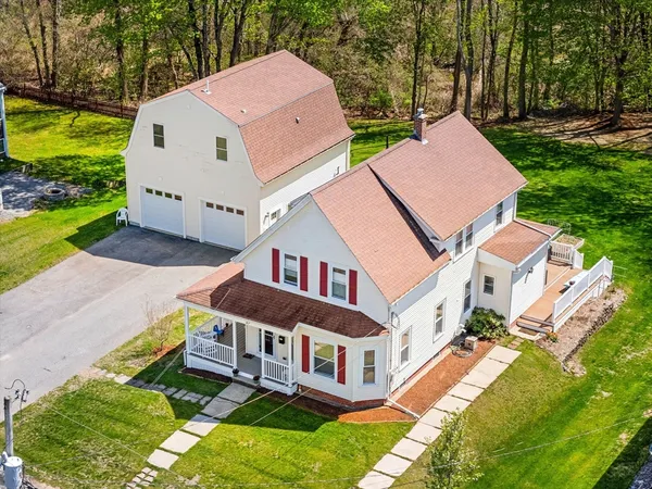 an aerial view of a house with a yard