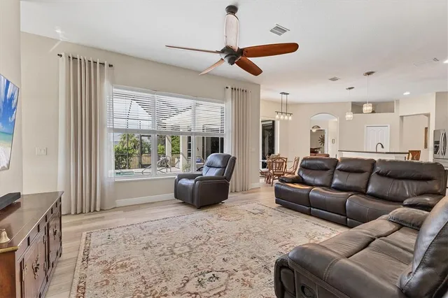 a spacious bathroom with a bathtub shower sink mirror and toilet