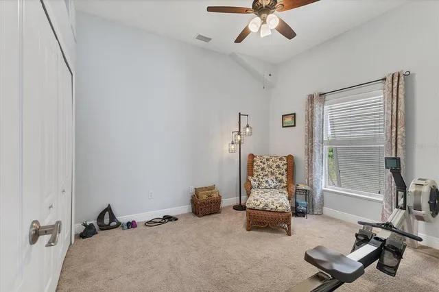 a view of a patio with a dining table and chairs