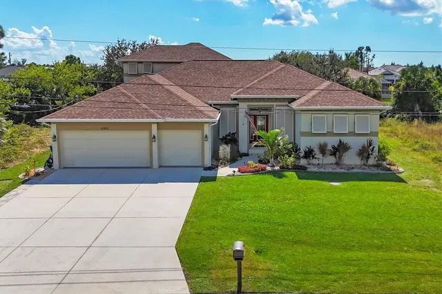 a front view of a house with garden