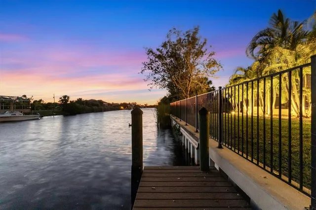 a sign board with a building in the background