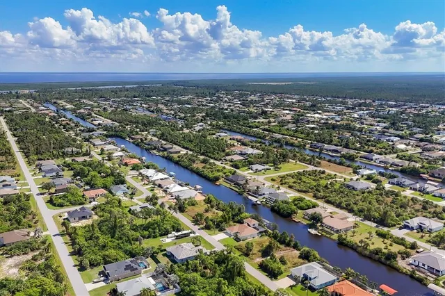 an aerial view of residential houses with outdoor space