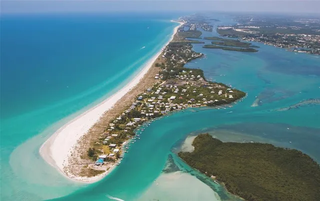 an aerial view of a house with a yard lake view and mountain view