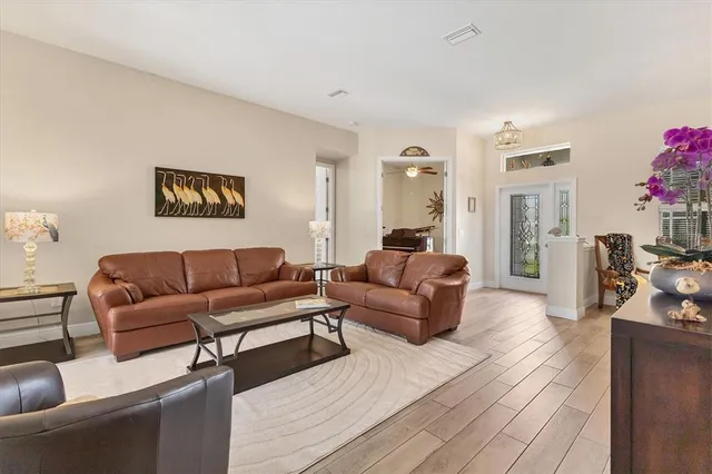 a living room with furniture and a large window